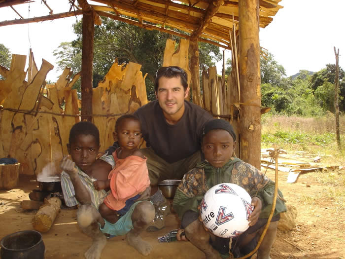 Paul Clarke with children in Malawi